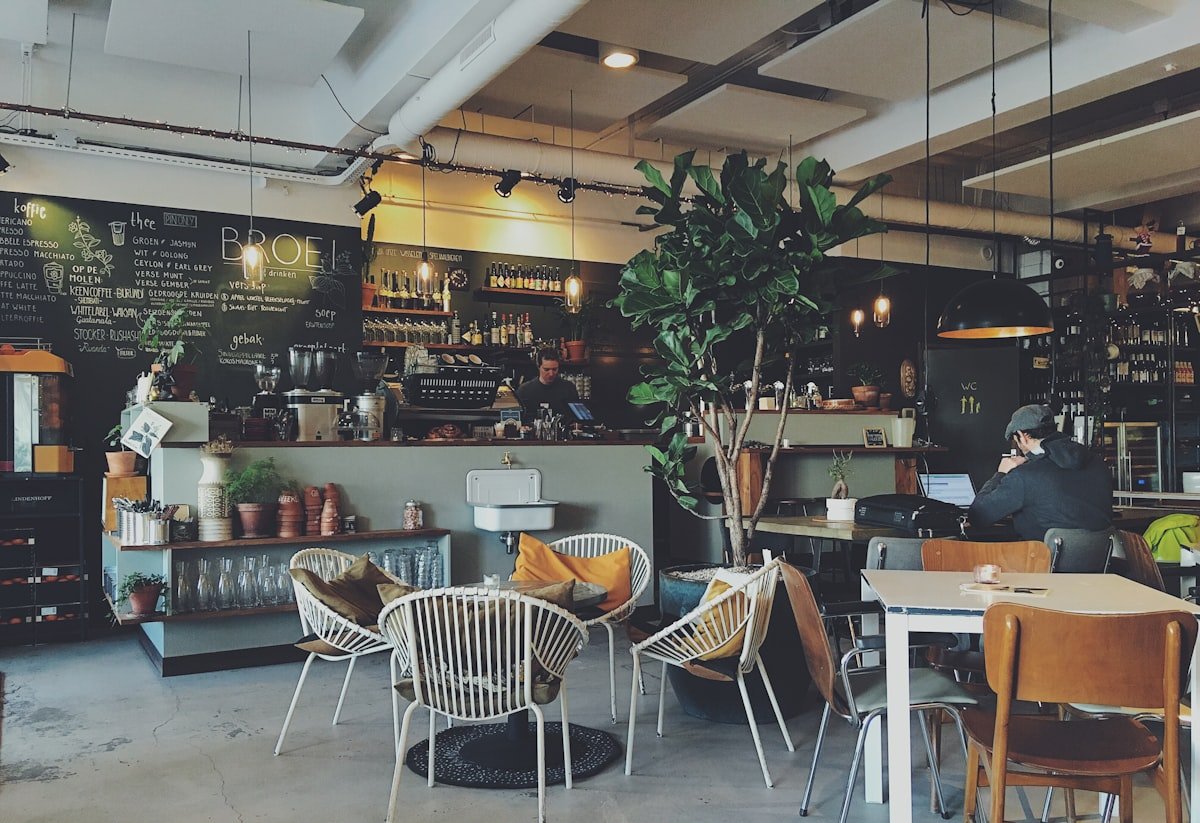 Cozy café interior with natural wood and pendant lighting